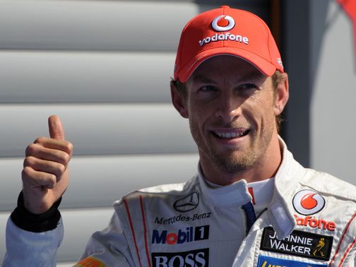 Jeson Button celebrates claiming pole position