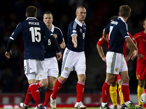 Miller celebrates scoring Scotland's equalising goal