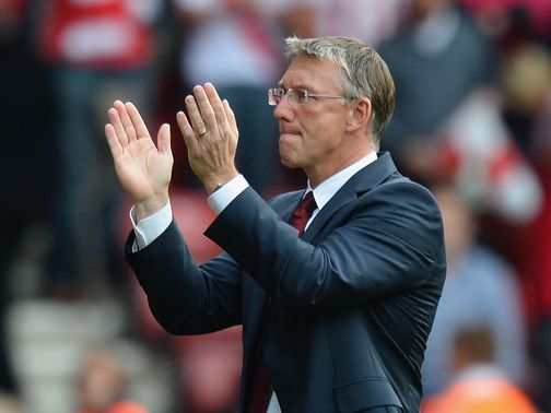 Adkins applauds the fans after victory