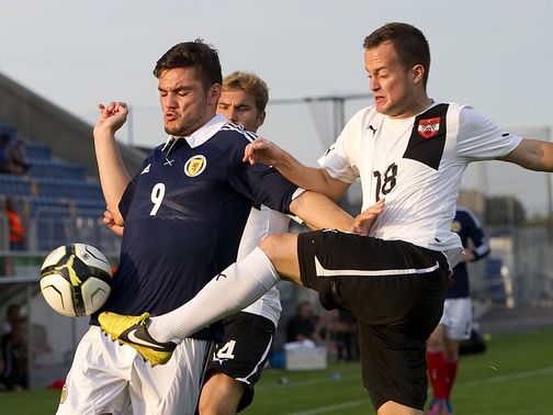 Tony Watt holds off Christian Klem.