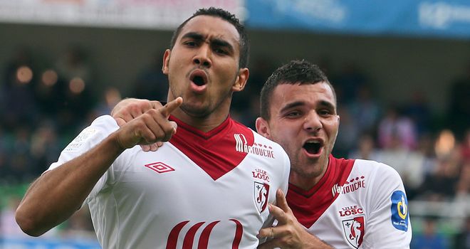 Payet (l) celebrates putting Lille ahead