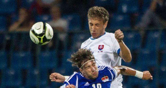 Mathias Christen and Kornel Salata go for a high ball.