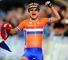 Vos celebrates her victory with the Dutch flag in hand