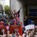 Some people take extreme measures to get a good view of their heroes.