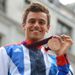 Diver Tom Daley shows off his bronze medal...