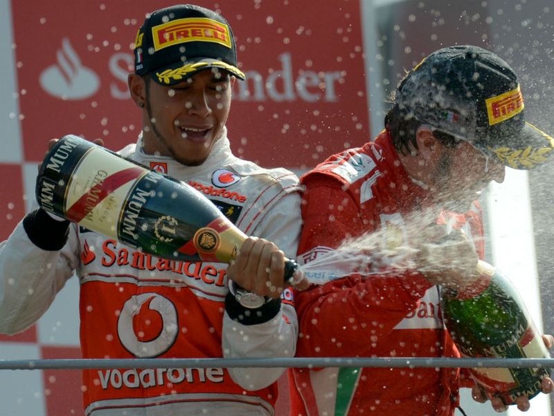 The former team-mates spray the bubbly