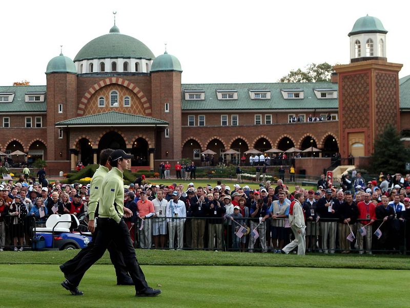 European duo McDowell & McIlroy make their way to the first tee and are greeted by a wall of sound.