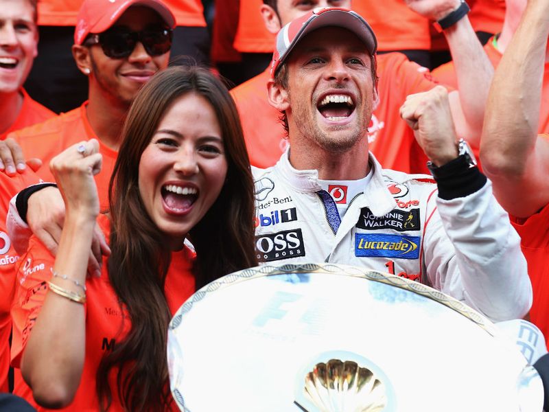 Jenson Button celebrates with Jessica Michibata