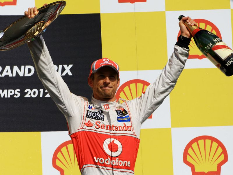 Jenson celebrates on the podium