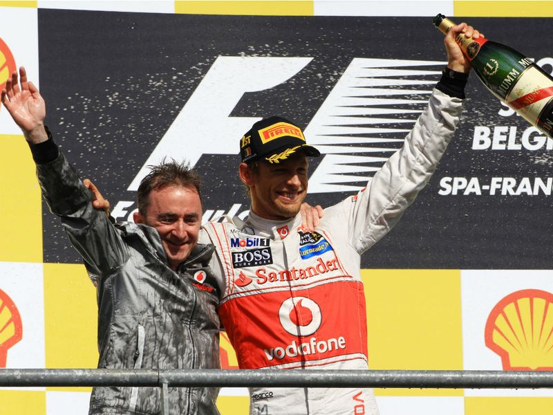 Jenson Button celebrates with Paddy Lowe