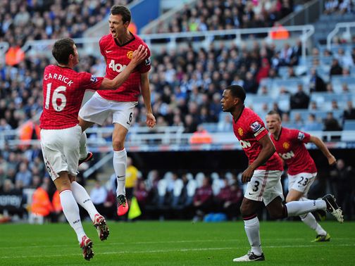 Jonny Evans celebrates a goal for Manchester United