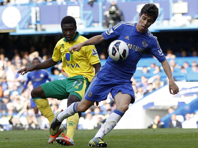 Oscar takes control of the ball.
