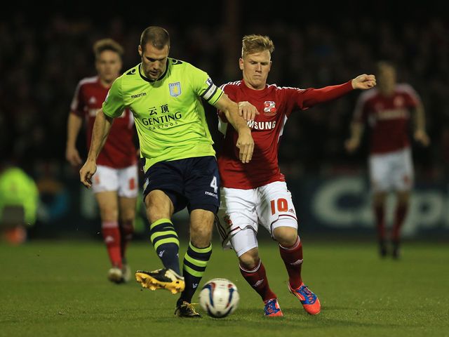 Matt Ritchie tries to challenge Ron Vlaar