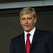 Arsenal manager Arsene Wenger watches the clash from the stands