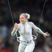 A performer on a high wire entertains the crowd before kick-off