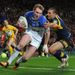 Joel Monaghan evades the challenge of Ryan Hall to score Warrington's second try to ensure the scores are level at 14-14 at half-time