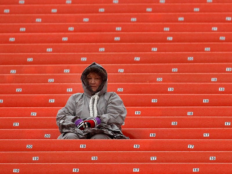 A fan waits patiently for the start of play at Cleveland Browns Stadium..