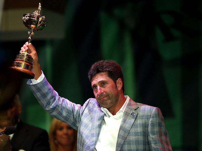 The Spaniard hoists the trophy to the cheers of the European supporters.