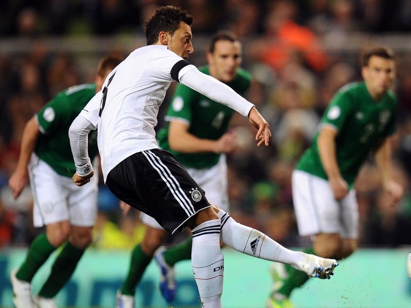 Mesut Ozil fires home third from penalty spot