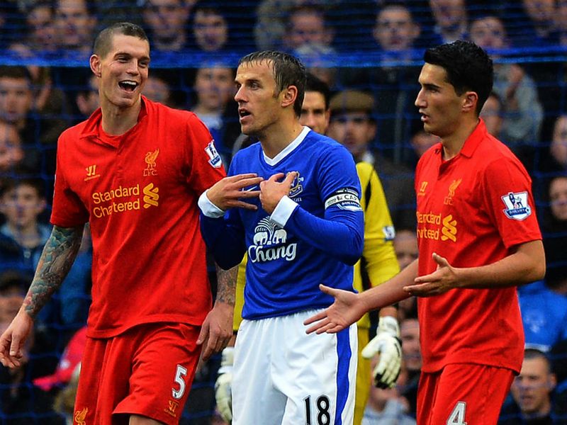 Everton captain Phil Neville protested his innocence after being booked for diving.