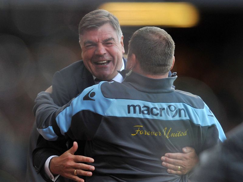 The West Ham bench are on their feet, Sam Allardyce celebrates his side's early lead.