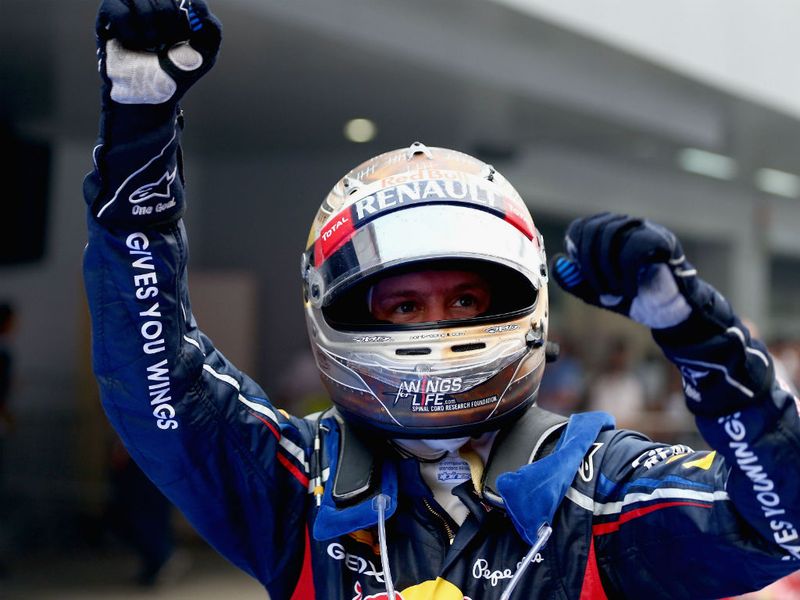 Vettel celebrates in parc ferme