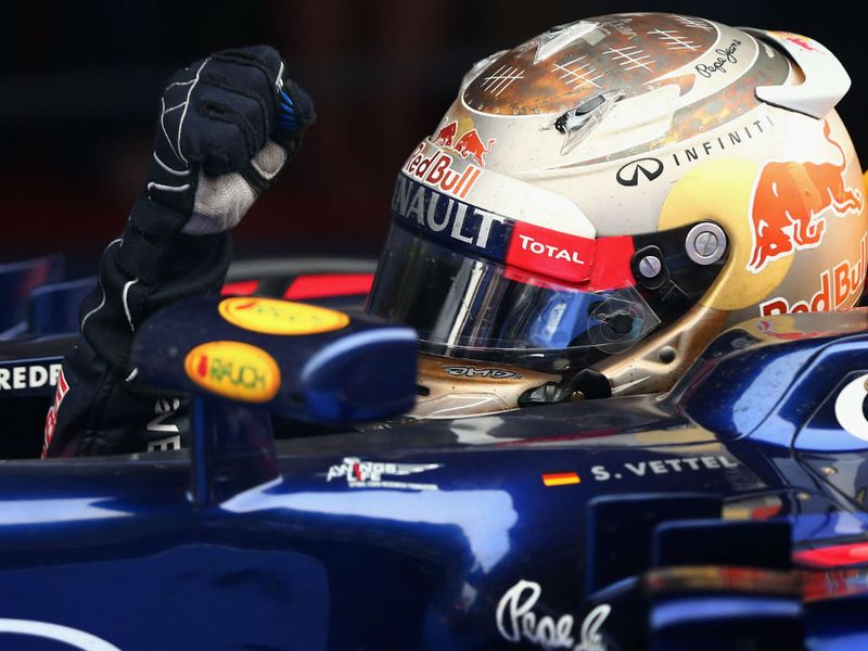 Vettel celebrates on his return to the pits