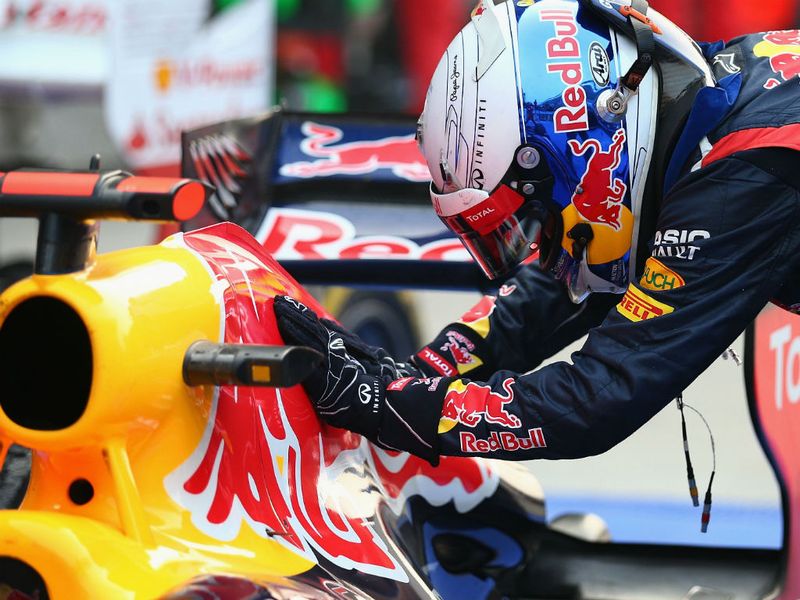 The winning car gets a pat from Vettel
