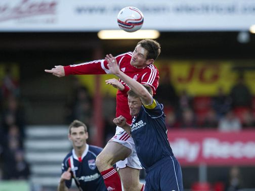 Scott Vernon leaps above Richard Brittain