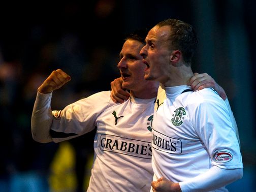 Paul Cairney and Leigh Griffiths celebrate for Hibs