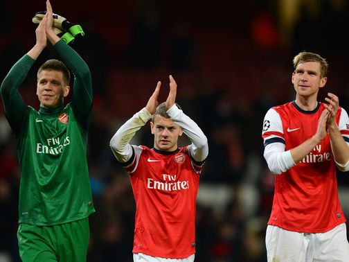 Arsenal celebrate reaching the last 16