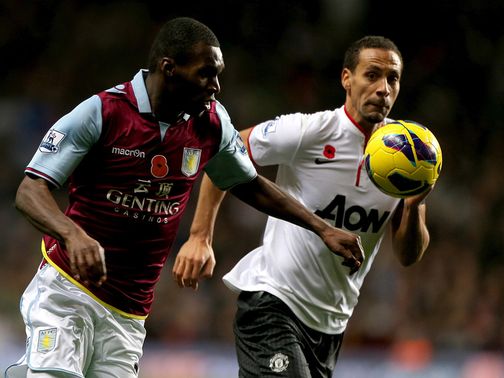 Christian Benteke and Rio Ferdinand battle for the ball