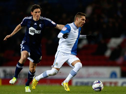 Keith Andrews and Ruben Rochina battle for the ball