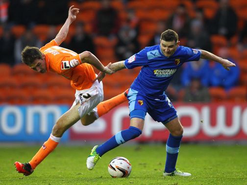 Chris Basham and Mark Yeats battle for the ball