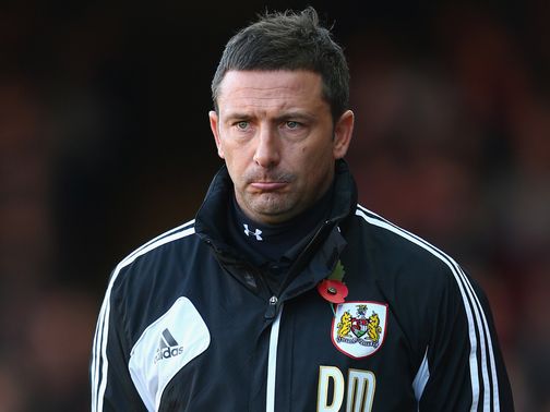 Derek McInnes watches the action unfold