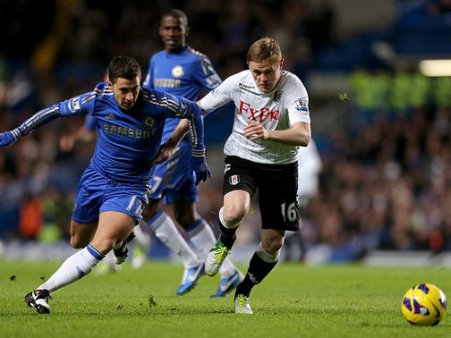 Eden Hazard and Damien Duff battle for the ball