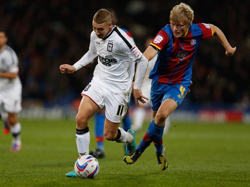 Lee Martin and Jonathan Parr battle for possession