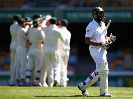 Hashim Amla walks off after he is dismissed for 38