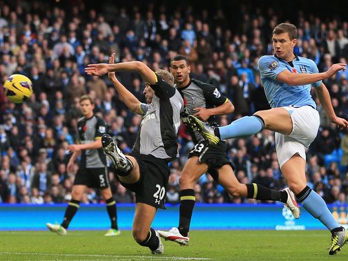 Edin Dzeko nets the winner for Man City