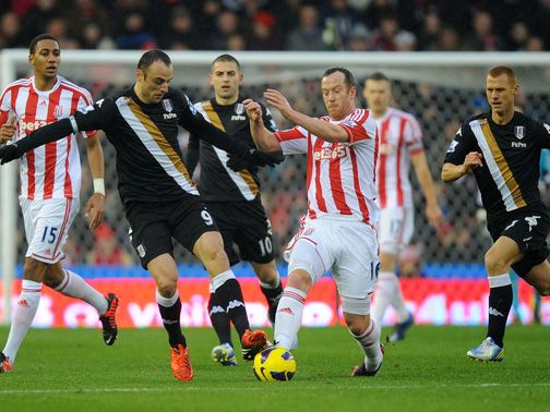Dimitar Berbatov and Charlie Adam battle for the ball