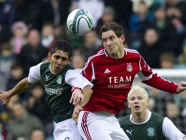 Claros goes up for the ball against Vernon