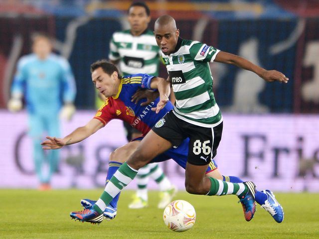 Marcelo Diaz and Gelson Fernandes battle for the ball