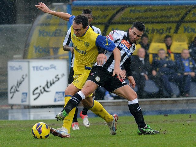 Dario Dainelli gets away from Antonio Di Natale