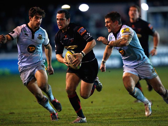 Dan Evans makes a break for the Dragons