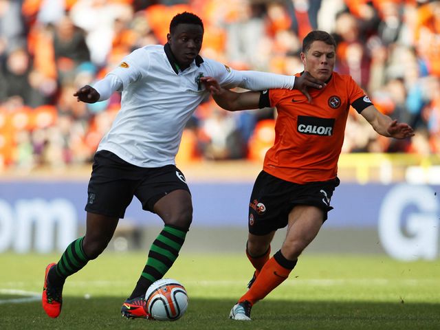 Victor Wanyama takes on John Rankin