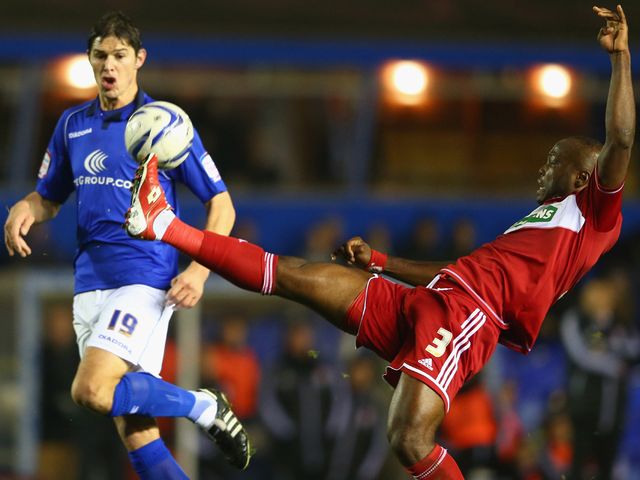 Nikola Zigic (l) closes down Boro's Andre Bikey