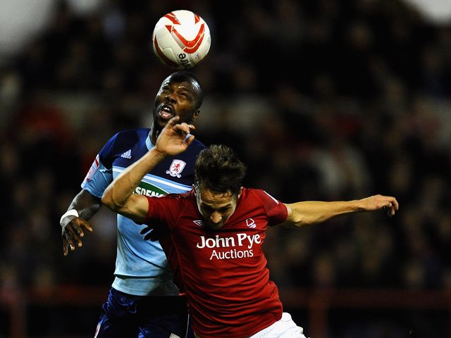 Andre Bikey and Chris Cohen battle for the ball
