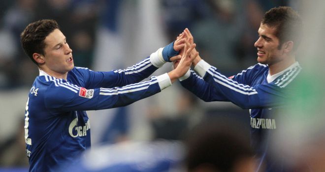 Julian Draxler (left) scored the winner for the hosts