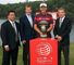 Ian Poulter poses with Tour chiefs George O'Grady (L) and Tim Finchem (R) after his triumph in China