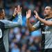 Caulker celebrates his second goal of the season with team-mate Sandro.